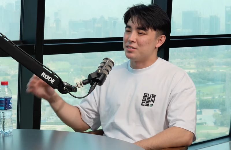 Julian Stafford hosting the Surgence Labs Podcast at a RODE microphone